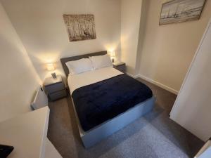 Ένα ή περισσότερα κρεβάτια σε δωμάτιο στο Manchester Extended Stay Apartments