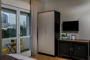 Kuchyň nebo kuchyňský kout v ubytování Dizengoff square boutique - aparthotel + 12 fotografií