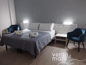 Un ou plusieurs lits dans un hébergement de l'établissement Vento di Mare