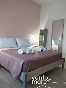Un ou plusieurs lits dans un hébergement de l'établissement Vento di Mare