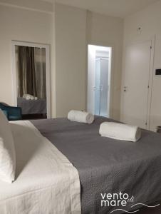 Un ou plusieurs lits dans un hébergement de l'établissement Vento di Mare