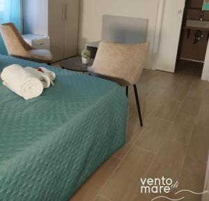 Un ou plusieurs lits dans un hébergement de l'établissement Vento di Mare
