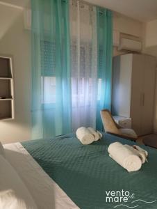Un ou plusieurs lits dans un hébergement de l'établissement Vento di Mare