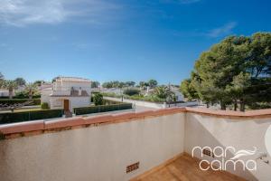 a view from the balcony of a house at Villa Dolce Relax by MarCalma in Les tres Cales
