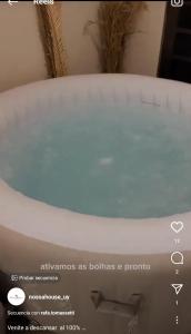 a close up of a bath tub with the wordsensions as bubbles a priority at Las toscas casa con piscina in Las Toscas