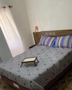 a bedroom with a bed with a table on it at Las toscas casa con piscina in Las Toscas