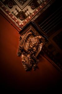 a gold object hanging from a ceiling at The Alamo Guest House in Glasgow