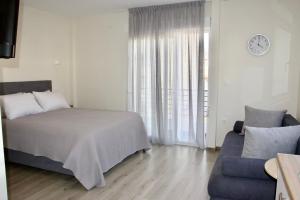 Postel nebo postele na pokoji v ubytování Piraeus Relax
