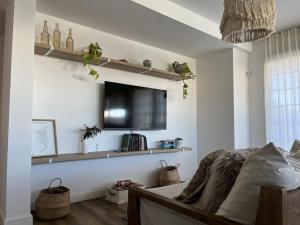 Μια τηλεόραση ή/και κέντρο ψυχαγωγίας στο Casa Coco en el sur de Mardel I Hola sur