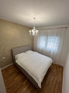 Säng eller sängar i ett rum på Apartment Nadaa
