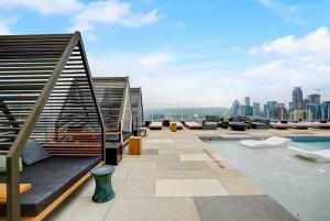a rooftop pool with a view of the city at Luxury 2BR Rooftop Pool Austin by Barclé in Austin