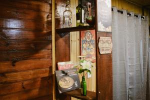 a room with a wooden wall with a curtain and a shelf at Morada das Estrelas in Cambara do Sul +47 photos