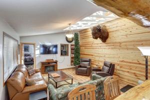 a living room with a couch and a tv at Buffalo Thunder Lodge in Deadwood