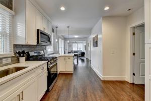 a kitchen with a sink and a stove top oven at Dreamy 3bed/3bath home with Yard in Atlanta