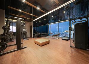 a gym with a view of the city at Super Luxury Designer Sleeps 6 People in Thonglor in Bangkok