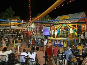 a crowd of people sitting in chairs at a carnival at Beach Paradise with Pool and Boating Dock in Freeport