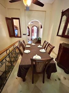 a dining room with a table and chairs in a room at Grand Bazaar El Conde in Santo Domingo