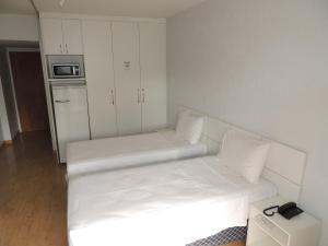 Cama o camas de una habitación en Brasilia Apart Hotéis