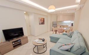 Televízia a/alebo spoločenská miestnosť v ubytovaní Amelie Apartment