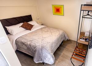 a bedroom with a bed and a shelf in it at La Puerta Del Sol in Arequipa