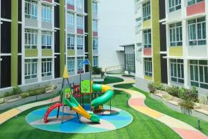 a playground in the middle of a apartment complex at Kuantan- Cozy Little Home @Mahkota Valley By VHOME in Kuantan