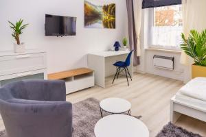 TV a/nebo společenská místnost v ubytování Apartement für 6 Personen in Magdeburg, L