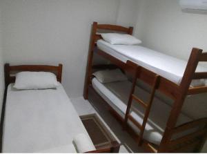 a room with two bunk beds in a room at Hostel Arena Prime in Salvador +2 photos