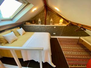 a bed in the middle of a room with a sink at Studios with Mezzanine Rua da Moeda in Lisbon +284 photos