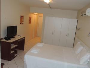 Cama o camas de una habitación en Brasilia Apart Hotéis