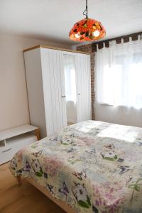 Postel nebo postele na pokoji v ubytování APARTMAN Tradicia