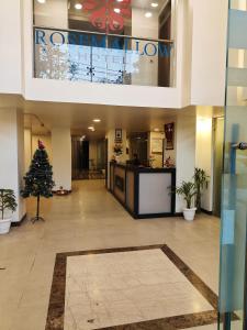 a lobby with a christmas tree in a building at RoseMallow Tavisha Hotel in New Delhi