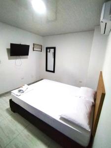 Voodi või voodid majutusasutuse Hotel Real del Valle toas