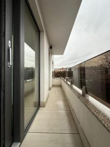 a hallway of a building with a view at Oasului Residence in Cluj-Napoca
