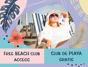 a young woman sitting in a beach chair at Sunny Seascape Villas & Aparts Hotel WiFi BBQ Los Corales BAVARO BEACH Club & spa in Punta Cana