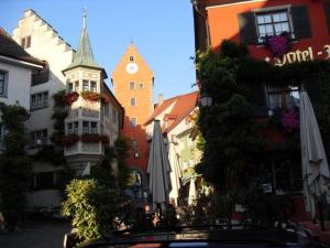 a city street with a building with a clock tower at Villa Lake Constance view in Stetten