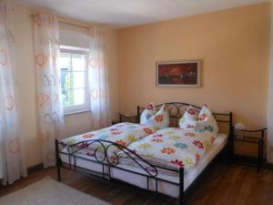 a bedroom with a bed and a window at Holiday home Weins Comfortable Vacation Home in Lieg