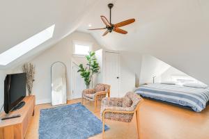 a bedroom with a bed and a ceiling fan at Bright and Pet-Friendly Home 2 Mi to Harvard Square in Watertown