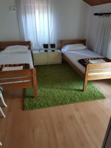 Posteľ alebo postele v izbe v ubytovaní Apartment in Mali Lošinj with Seaview, Terrace, Air condition, WIFI (3780-2) + 28 fotografií