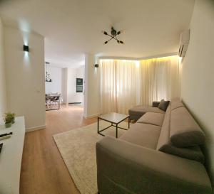 a living room with a couch and a table at Apartment Rea in Čapljina