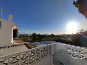 a view from the balcony of a villa with a swimming pool at VILLAMOR in Albufeira