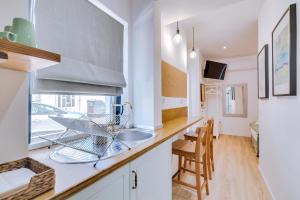 TV a/nebo společenská místnost v ubytování Luminosa Holidays House