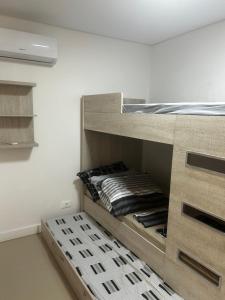 Postel nebo postele na pokoji v ubytování Apartamento no centro