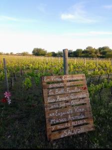 a sign in front of a field of vines at Finca Doña Antonia in Pueblo Moreno +4 photos