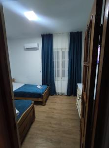 Postel nebo postele na pokoji v ubytování Ortachala Summer House