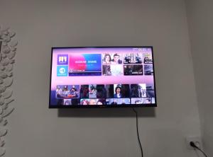 a flat screen tv hanging on a wall at Ortachala Summer House in Tbilisi City