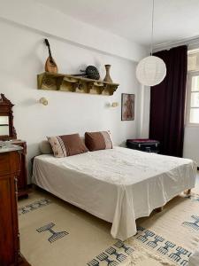 a bedroom with a large bed in a room at Chez Chichi in Sicca Veneria