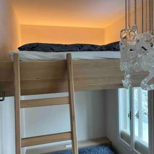 a bunk bed in a room with a window at Jugendstiljuwel in Bad Gastein in Bad Gastein