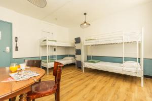 Cama o camas de una habitación en Young and Happy Latin Quarter by Hiphophostels