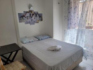 En eller flere senge i et værelse på Pousada Catarina Mina