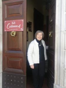 a woman standing in the doorway of a door at Bed & Breakfast Costanza4 in Scanno